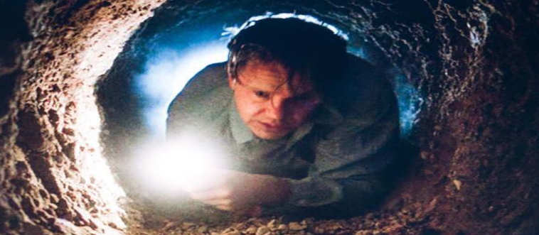 A fellow spends years working with a tiny tool to find freedom through a long, rainy tunnel.